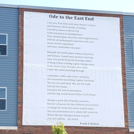 A building with a large poem, Ode to East End, on its wall